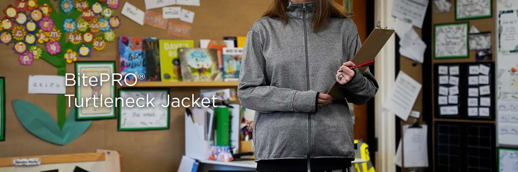 Teacher wearing a comfortable BitePRO turtleneck jacket